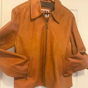Distressed burnt orange leather jacket.